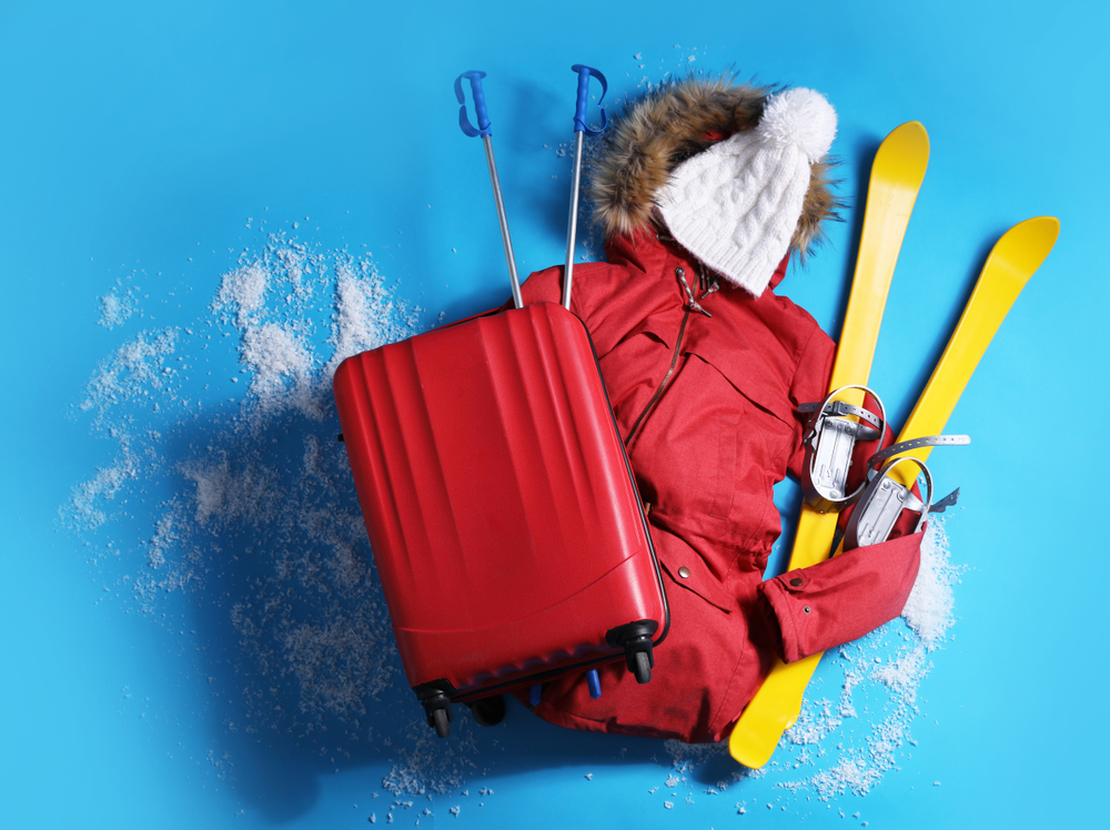 march is the best time to buy the pictured winter gear (skis, coat, and hat) and luggage